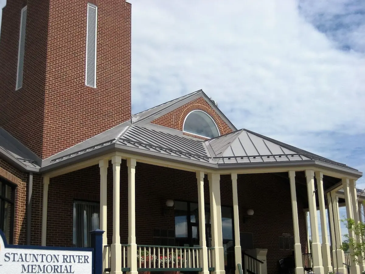 Skilled roofing craftsmen working on a residential roof in Stanchfield